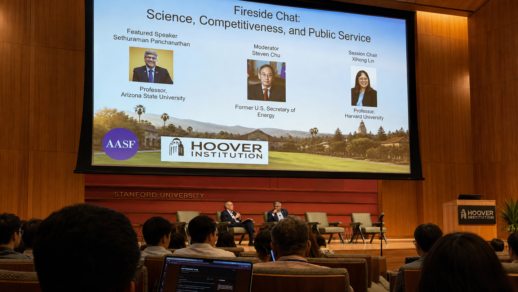 AASF Fireside Chat at Stanford University featuring Sethuraman Panchanathan and Steven Chu, with attendees using Intent Live Caption for real-time interpretation during the conference.